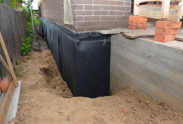 Happy homeowners after waterproofing job in Albertville